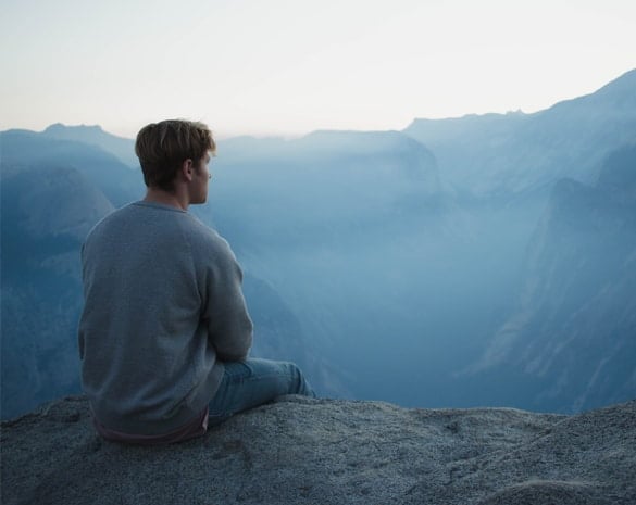 Man sitting on mountains
